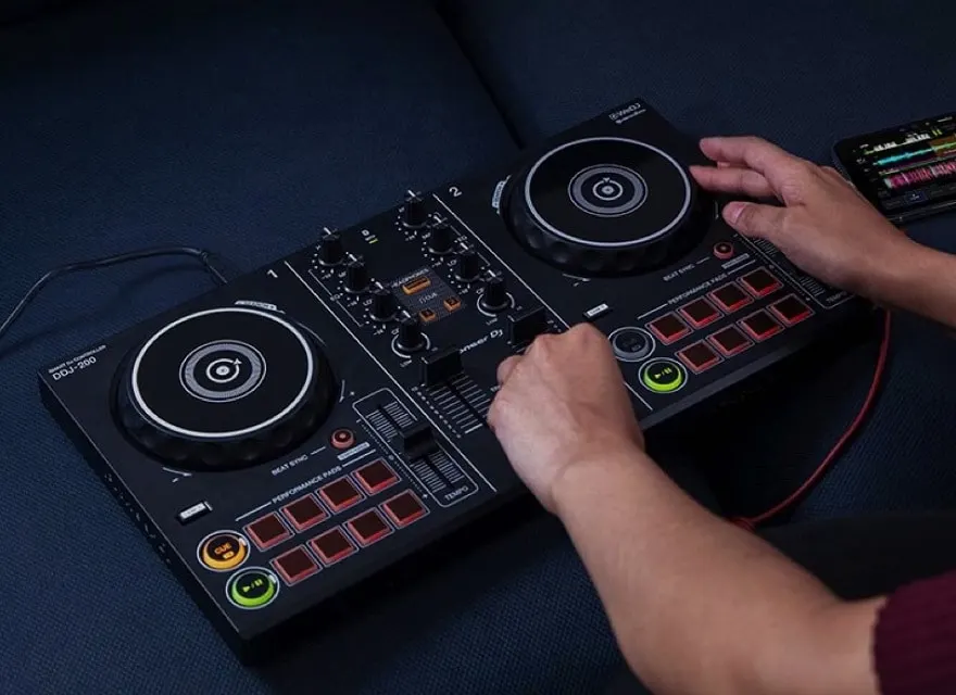 How do I connect my DJ controller to my speakers?