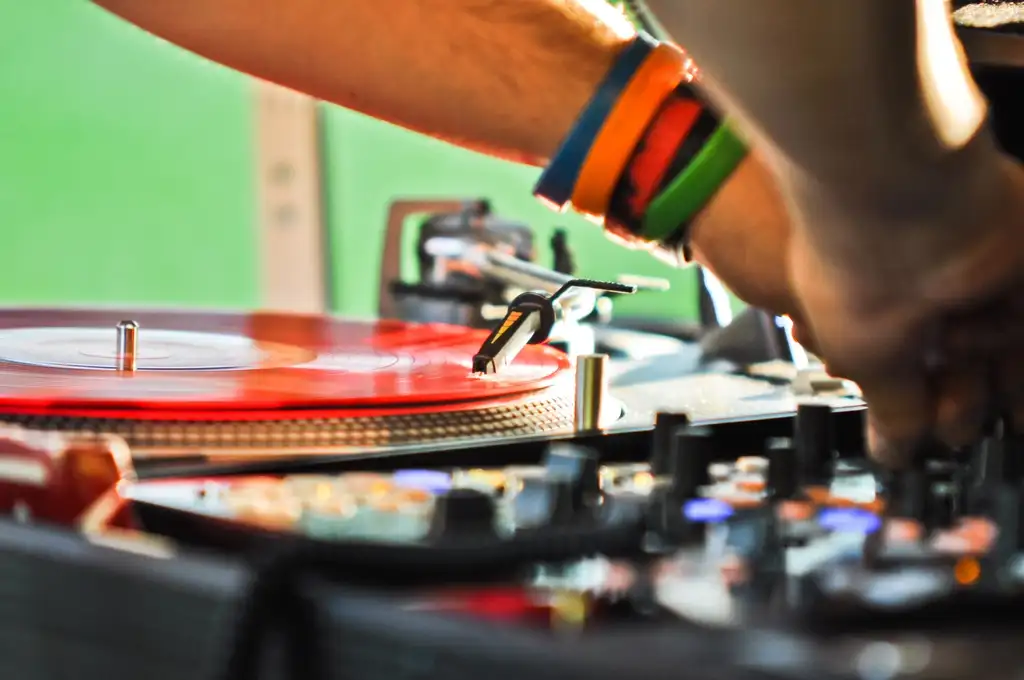 Where do DJs usually perform?