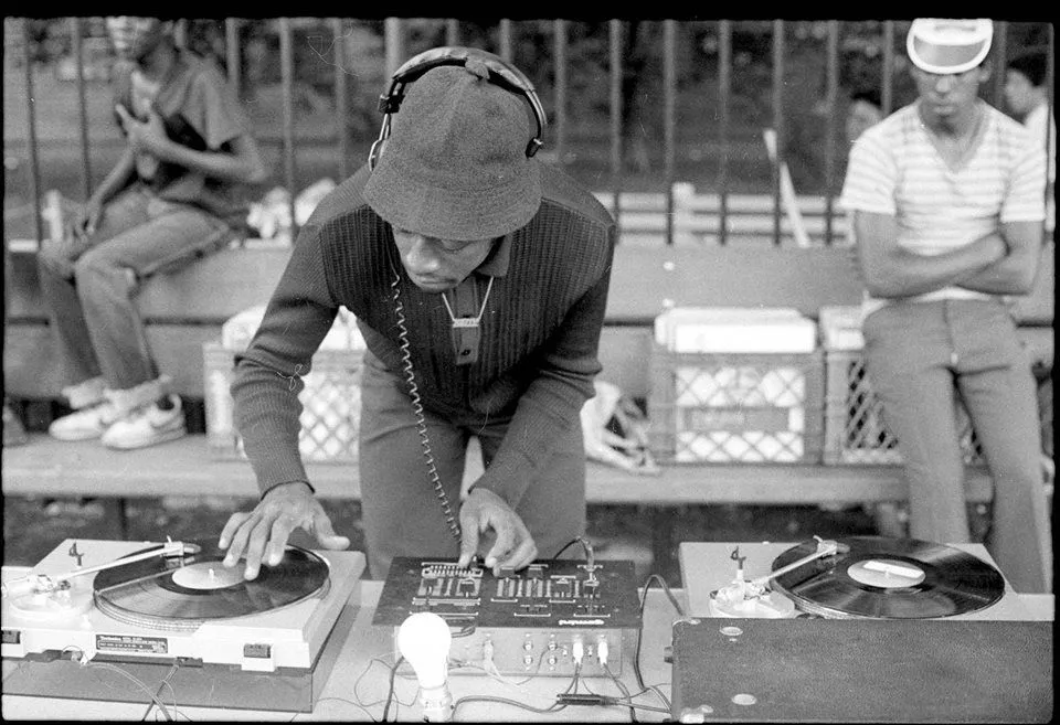 Which 1970s NYC DJ is considered to be the godfather of hip-hop?