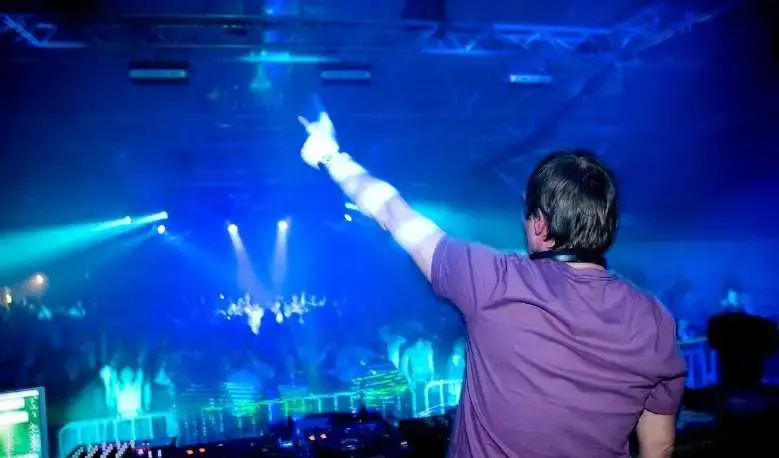 What do techno DJs do on stage?