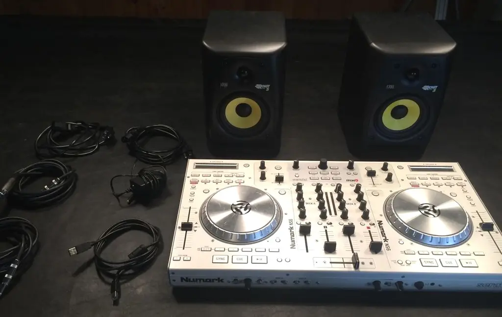 How do I connect my DJ controller to my speakers?