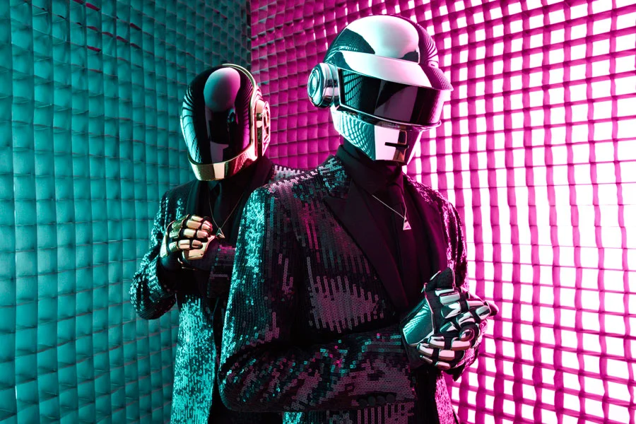 Who are the 2 singers with helmets?